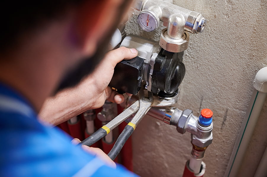 Plumber working onsite protected by plumbers insurance
